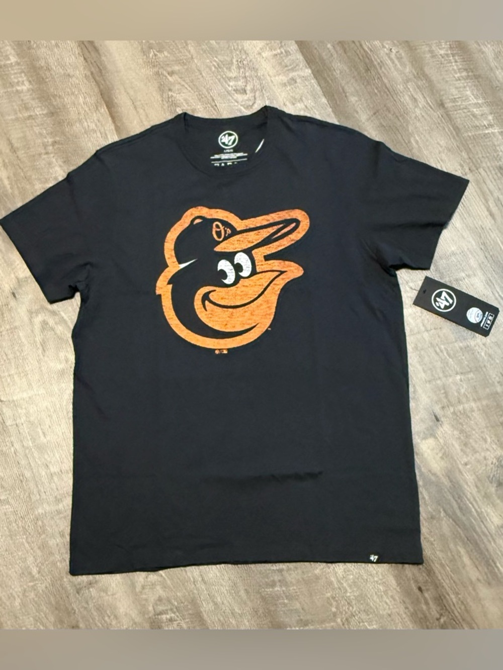 47 Brand Black Tee with Orange Orioles Logo